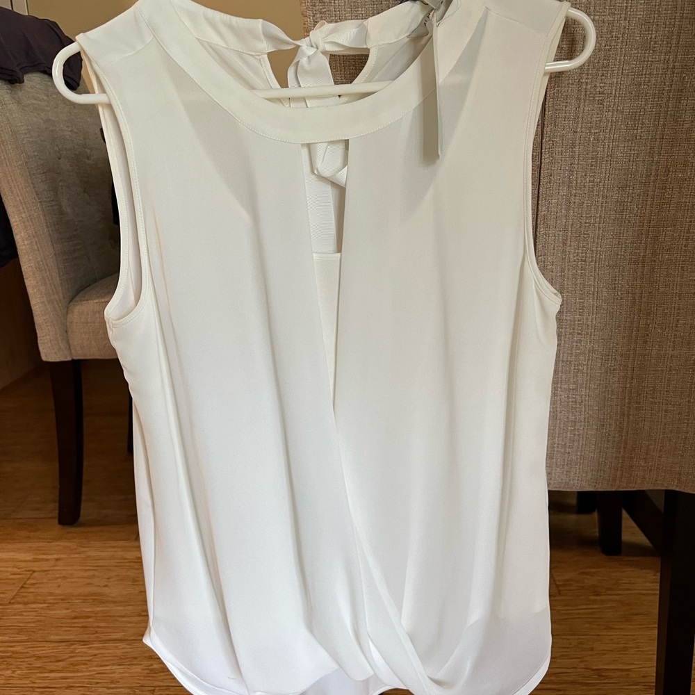 Super soft breathable light flowy but fitted dress/casual sleeveless top.